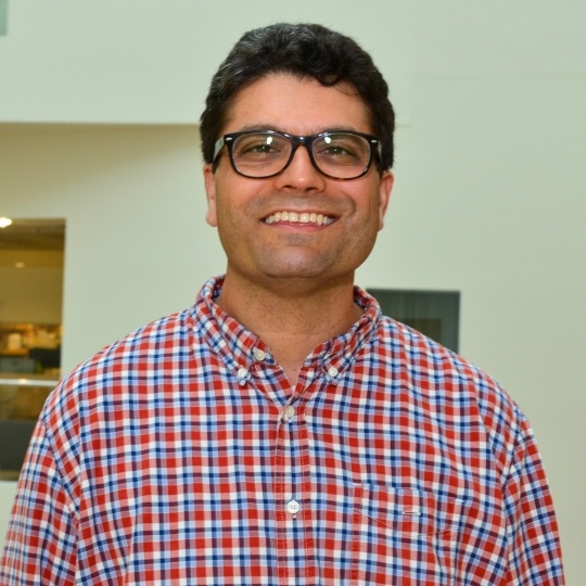 Image of smiling man with glasses